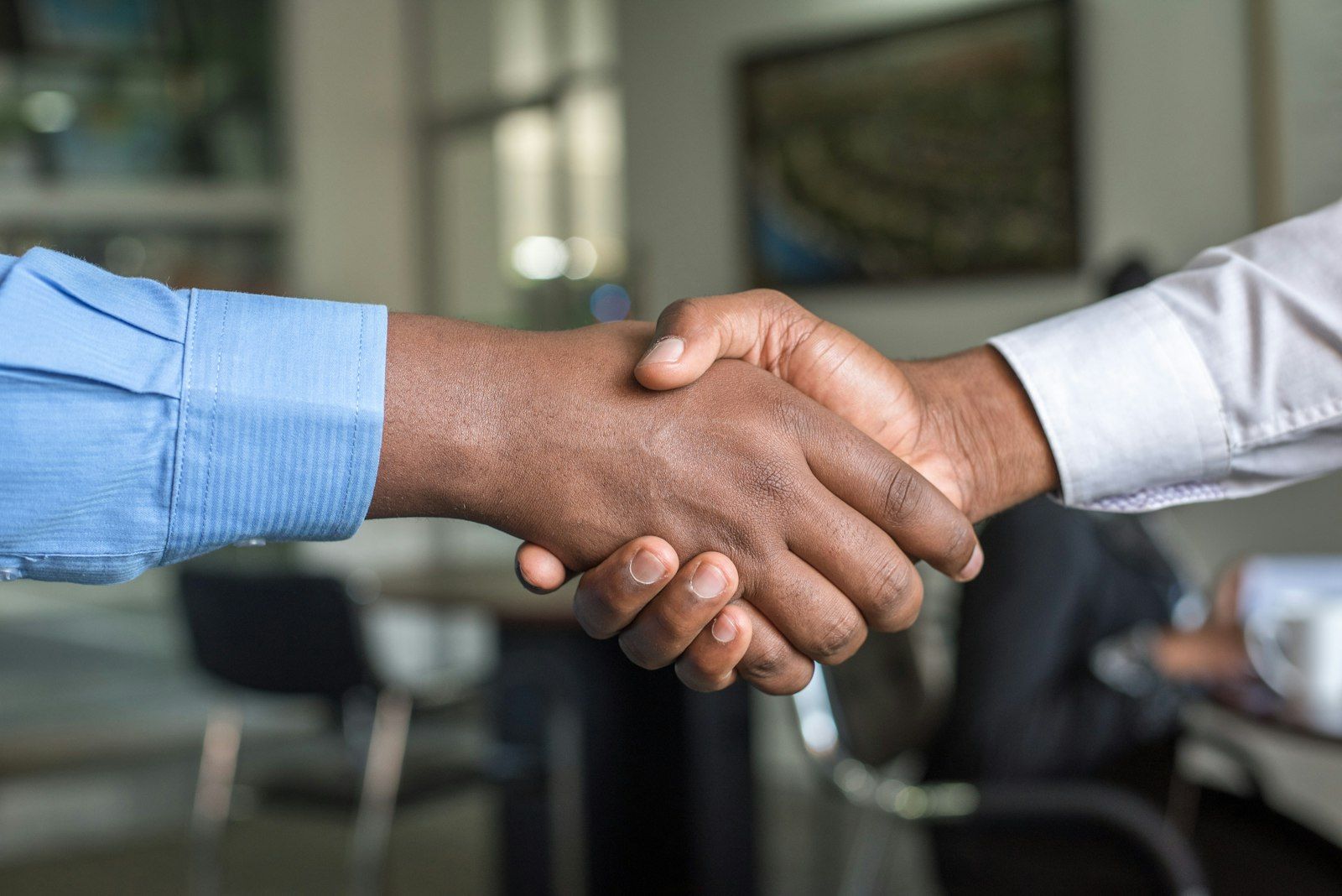 A contractor closing a deal on a handshake